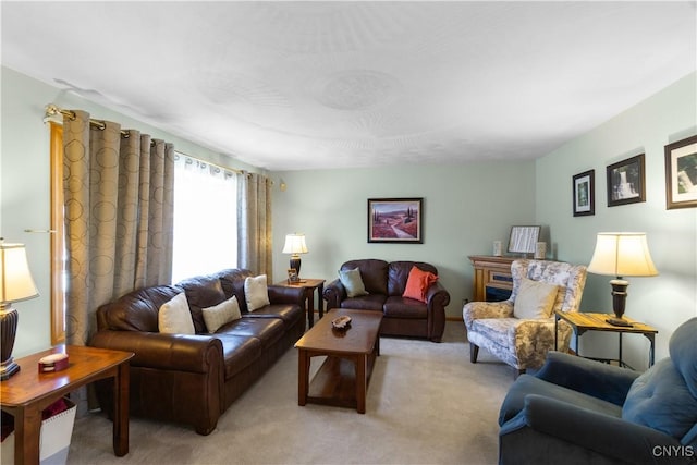 living area featuring light carpet