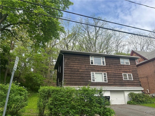 1018-20 Ackerman Ave Unit 1020, Syracuse, NY 13210 - view of home's exterior featuring an attached garage and driveway