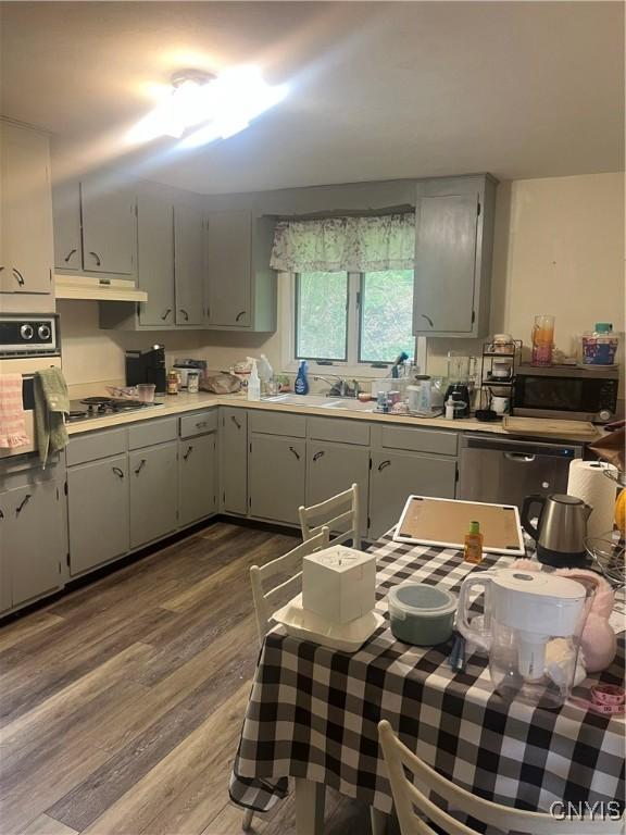 1018-20 Ackerman Ave Unit 1020, Syracuse, NY 13210 - kitchen with oven, gray cabinetry, stainless steel microwave, and dark wood-style floors