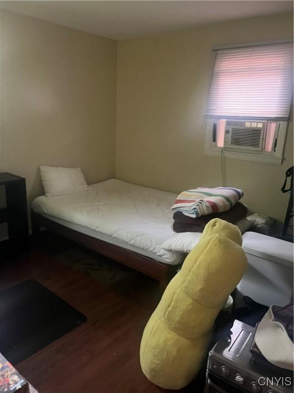 1018-20 Ackerman Ave Unit 1020, Syracuse, NY 13210 - bedroom with wood finished floors and cooling unit