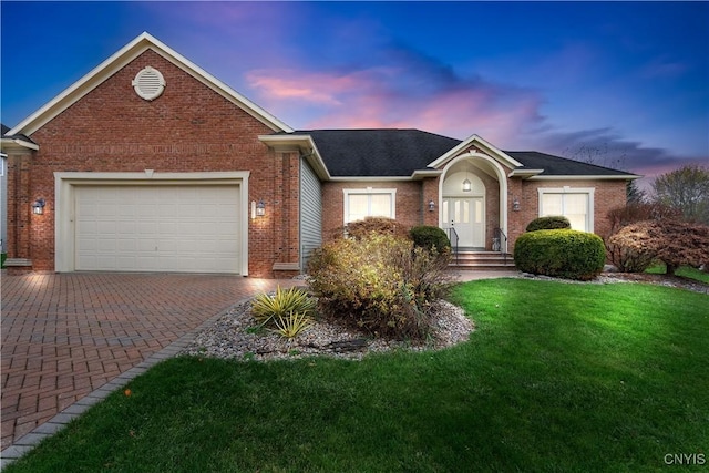 8312 Partridgeberry Dr, Lysander, NY 13027 - ranch-style house featuring brick siding, decorative driveway, a garage, and a front yard