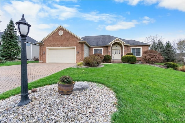 8312 Partridgeberry Dr, Lysander, NY 13027 - ranch-style house with brick siding, an attached garage, a front lawn, and driveway