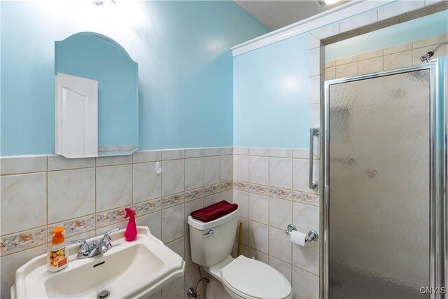8312 Partridgeberry Dr, Lysander, NY 13027 - bathroom with a sink, a stall shower, toilet, and tile walls