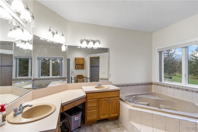 8312 Partridgeberry Dr, Lysander, NY 13027 - bathroom with a garden tub and double vanity