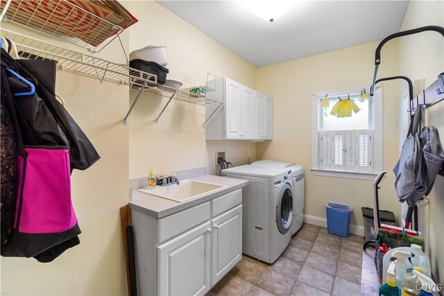 8312 Partridgeberry Dr, Lysander, NY 13027 - clothes washing area featuring washer and dryer, baseboards, and cabinet space