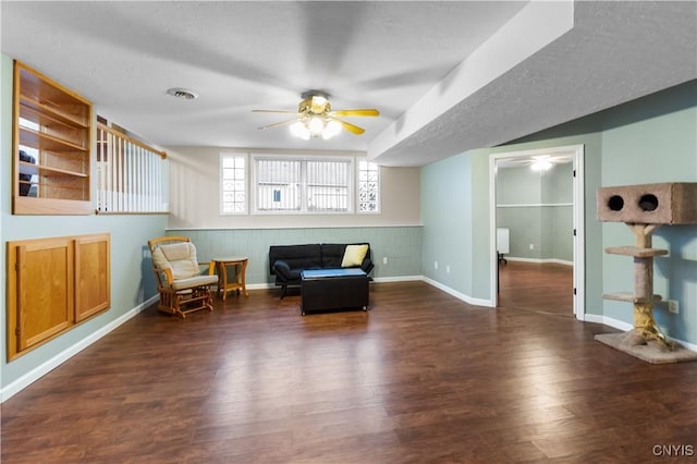8312 Partridgeberry Dr, Lysander, NY 13027 - sitting room with ceiling fan, wood finished floors, and baseboards