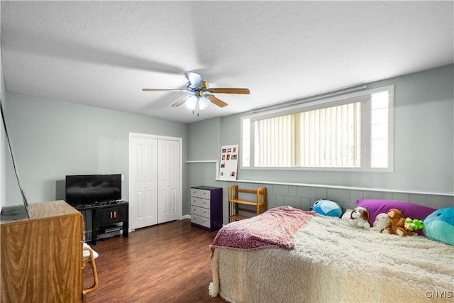 8312 Partridgeberry Dr, Lysander, NY 13027 - bedroom featuring dark wood finished floors, a closet, and ceiling fan