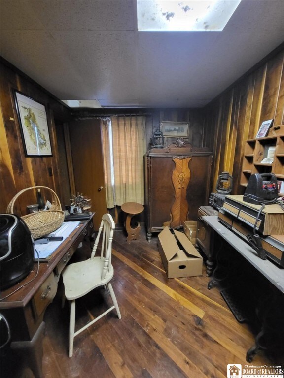 5162 Whig St, Little Valley, NY 14779 - home office featuring wood walls and dark wood-type flooring
