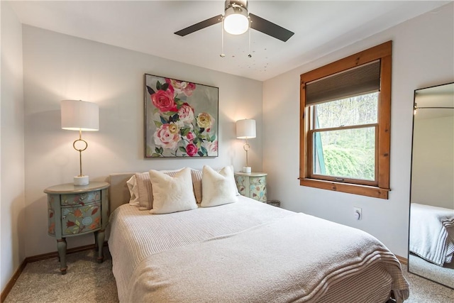 carpeted bedroom with baseboards and ceiling fan