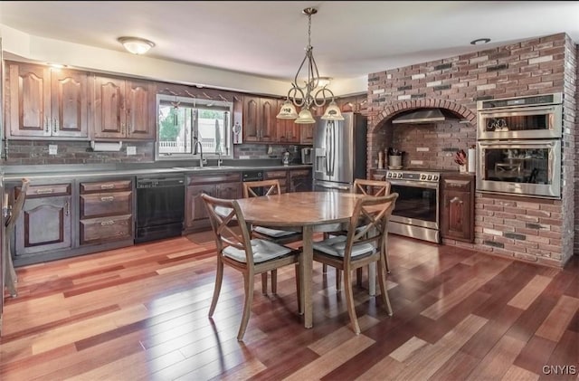 dining area with light wood-style flooring