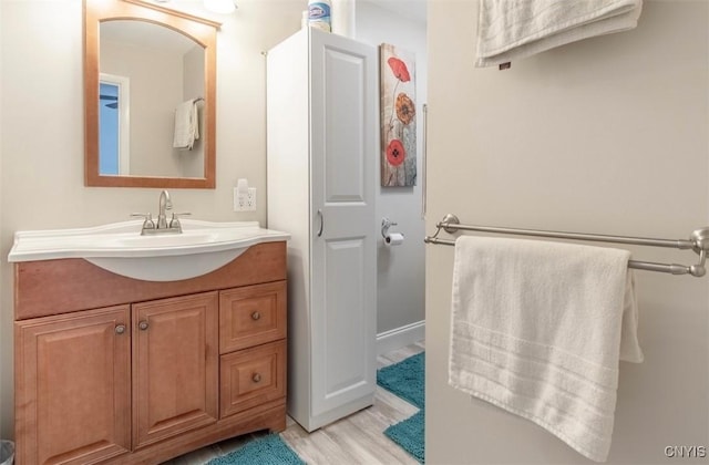 bathroom featuring vanity and wood finished floors