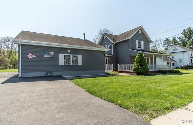 view of front of house featuring a front yard and a porch