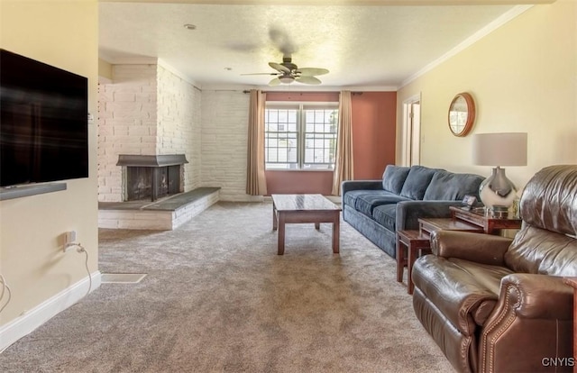 living area with ceiling fan, carpet, crown molding, a fireplace, and baseboards