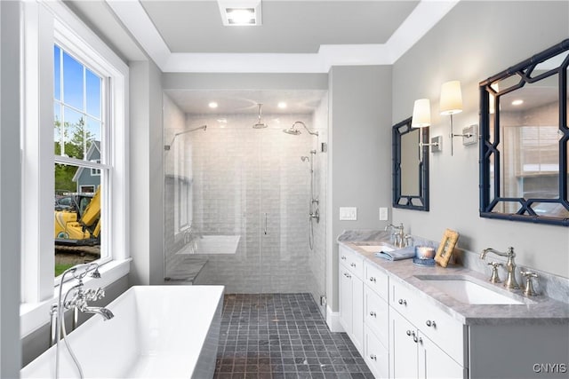 full bathroom with a stall shower, a freestanding tub, double vanity, and tile patterned floors