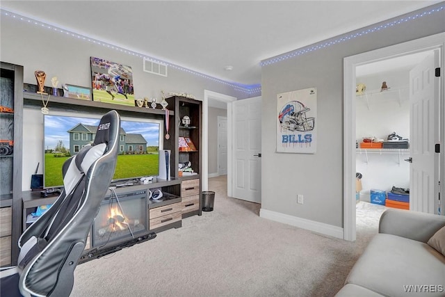 workout room with carpet floors and baseboards