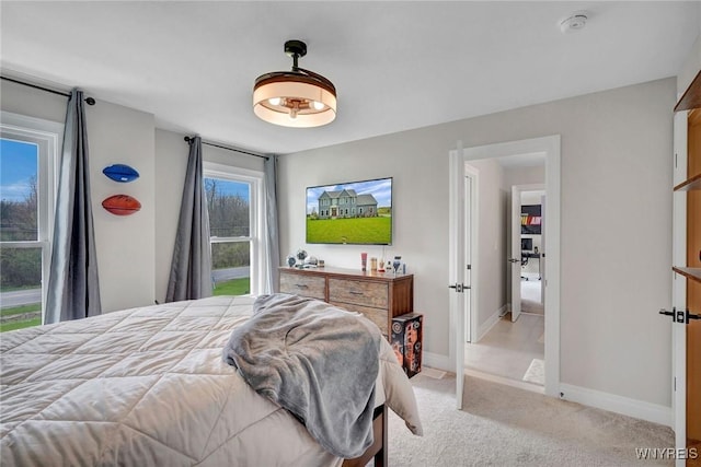 bedroom with carpet floors and baseboards