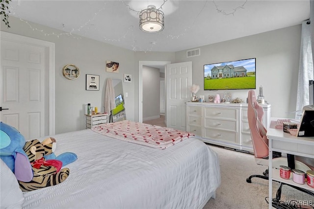 bedroom featuring light carpet