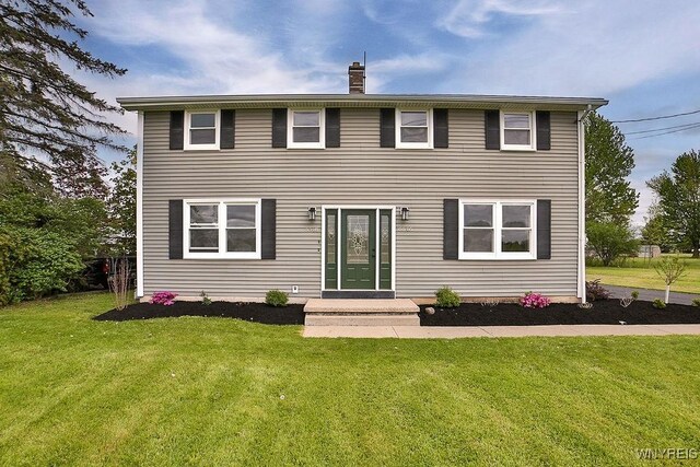 6648 Errick Rd, Wheatfield, NY 14120 - view of front of home featuring a front lawn and a chimney