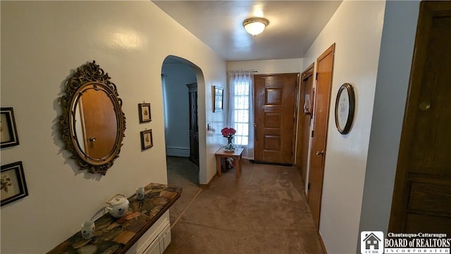 3738 E Lake Rd, Dunkirk-Town, NY 14048 - corridor featuring arched walkways, baseboard heating, and carpet