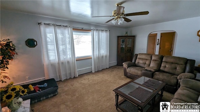 3738 E Lake Rd, Dunkirk-Town, NY 14048 - living area featuring arched walkways, a baseboard radiator, light carpet, and ceiling fan