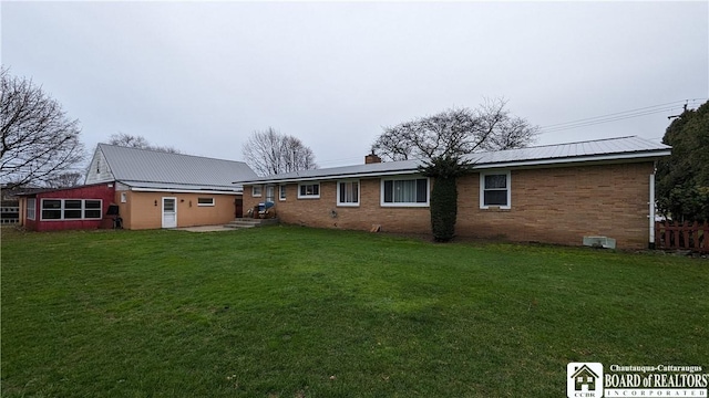 3738 E Lake Rd, Dunkirk-Town, NY 14048 - rear view of house featuring brick siding, a chimney, and metal roof
