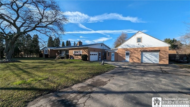 3738 E Lake Rd, Dunkirk-Town, NY 14048 - view of front of home with driveway, a front lawn, a garage, and brick siding