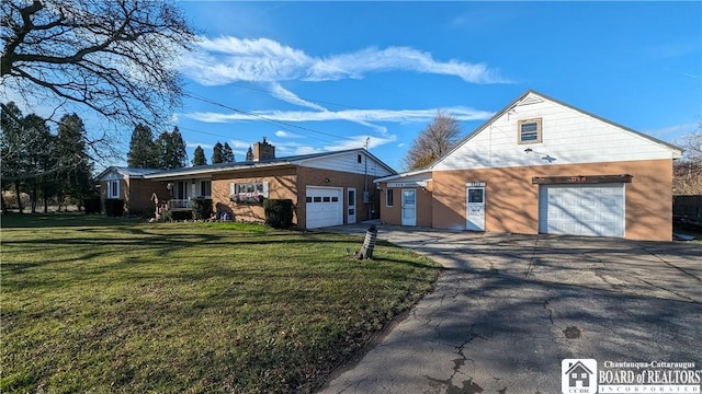 3738 E Lake Rd, Dunkirk-Town, NY 14048 - view of front of home featuring asphalt driveway, a front lawn, and an attached garage