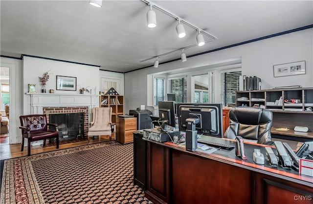 2810 Genesee St, Utica, NY 13502 - home office featuring a fireplace, plenty of natural light, and rail lighting
