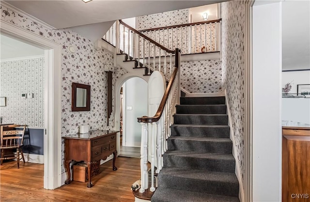 2810 Genesee St, Utica, NY 13502 - stairway with wallpapered walls and wood finished floors