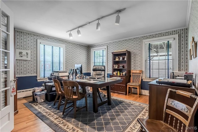 2810 Genesee St, Utica, NY 13502 - home office featuring wallpapered walls, wood finished floors, rail lighting, and baseboard heating