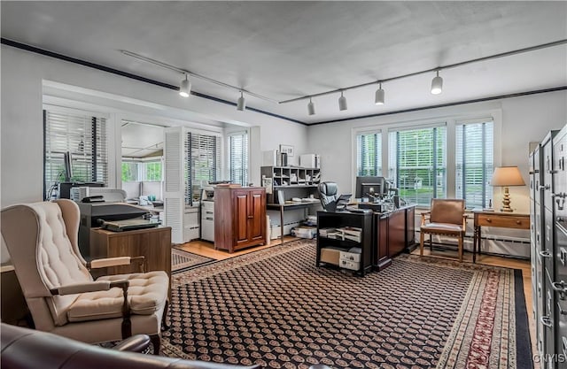2810 Genesee St, Utica, NY 13502 - office with track lighting, healthy amount of natural light, a baseboard radiator, and wood finished floors