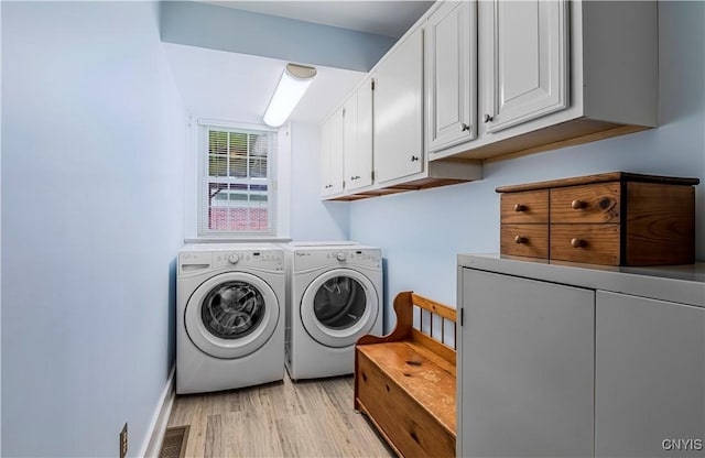2810 Genesee St, Utica, NY 13502 - laundry room featuring cabinet space, independent washer and dryer, light wood-type flooring, and baseboards