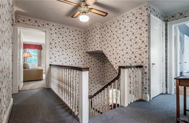 2810 Genesee St, Utica, NY 13502 - corridor with wallpapered walls, carpet, crown molding, and an upstairs landing