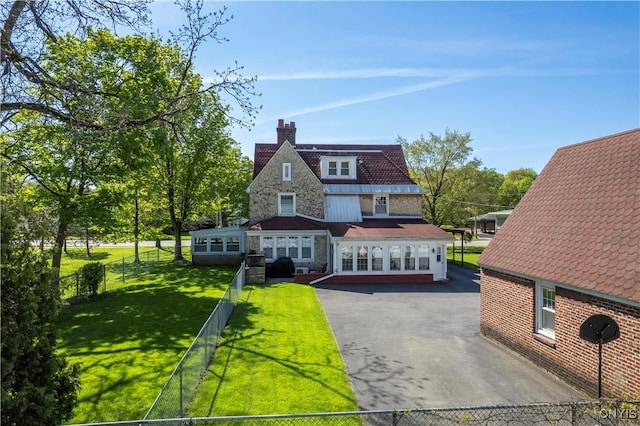 2810 Genesee St, Utica, NY 13502 - rear view of house with a chimney, french doors, stone siding, and driveway
