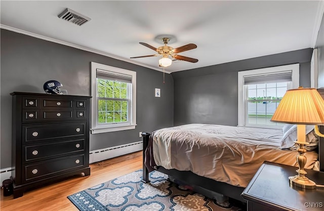 2810 Genesee St, Utica, NY 13502 - bedroom with a baseboard radiator, multiple windows, ornamental molding, light wood-type flooring, and ceiling fan