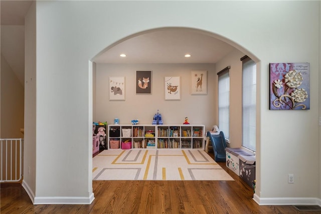 318 Wexford Ln, Horseheads, NY 14845 - rec room with wood finished floors, recessed lighting, arched walkways, and baseboards