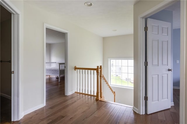 318 Wexford Ln, Horseheads, NY 14845 - corridor featuring an upstairs landing, wood finished floors, and baseboards