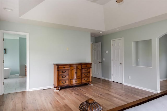 318 Wexford Ln, Horseheads, NY 14845 - bedroom with wood finished floors, baseboards, arched walkways, ensuite bathroom, and recessed lighting