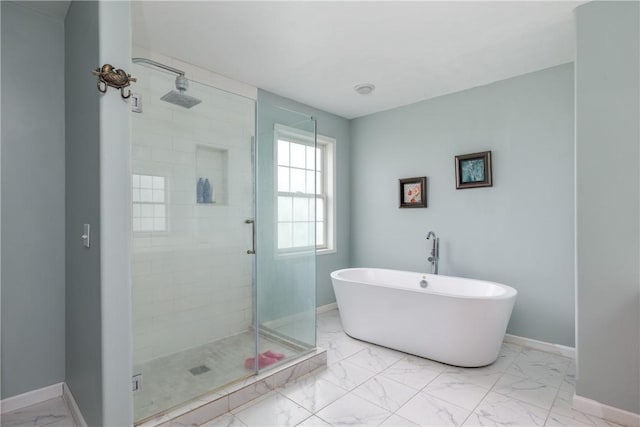 318 Wexford Ln, Horseheads, NY 14845 - full bathroom featuring marble finish floors, a stall shower, a freestanding bath, and baseboards