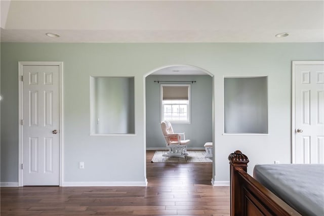 318 Wexford Ln, Horseheads, NY 14845 - bedroom featuring arched walkways, dark wood-style floors, baseboards, and recessed lighting