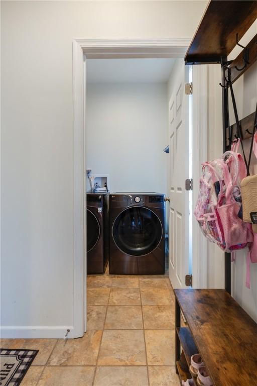 318 Wexford Ln, Horseheads, NY 14845 - laundry room with separate washer and dryer and baseboards