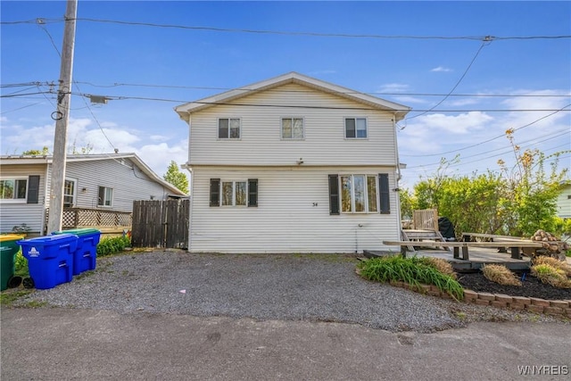 back of property with fence