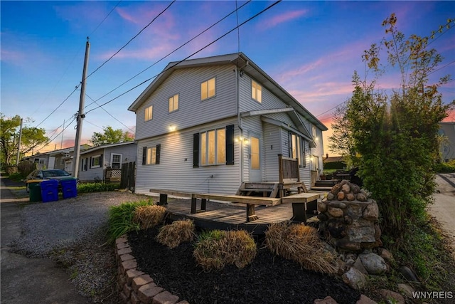 back of property with a deck