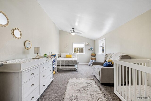 bedroom with lofted ceiling, carpet, baseboards, a ceiling fan, and a nursery area