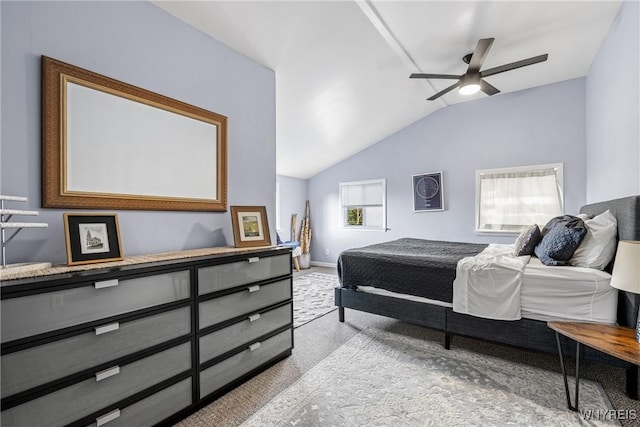 carpeted bedroom featuring lofted ceiling and baseboards