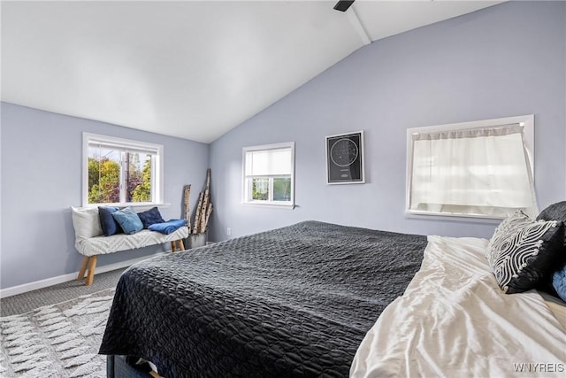 bedroom featuring lofted ceiling, carpet, and baseboards
