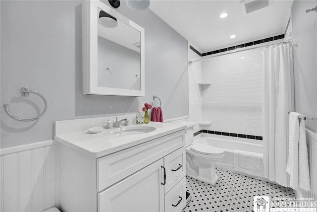 3 Maple Ave, Chautauqua, NY 14722 - full bathroom featuring toilet, vanity, shower / bath combo, and wainscoting