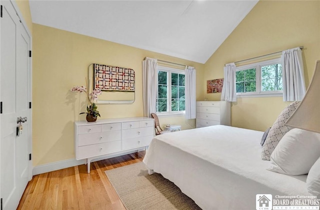 3 Maple Ave, Chautauqua, NY 14722 - bedroom with light wood finished floors, baseboards, and high vaulted ceiling