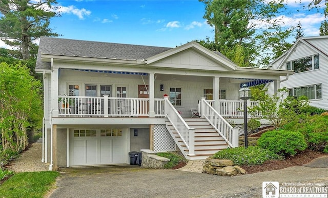 3 Maple Ave, Chautauqua, NY 14722 - view of front facade with a porch, driveway, stairs, an attached garage, and roof with shingles