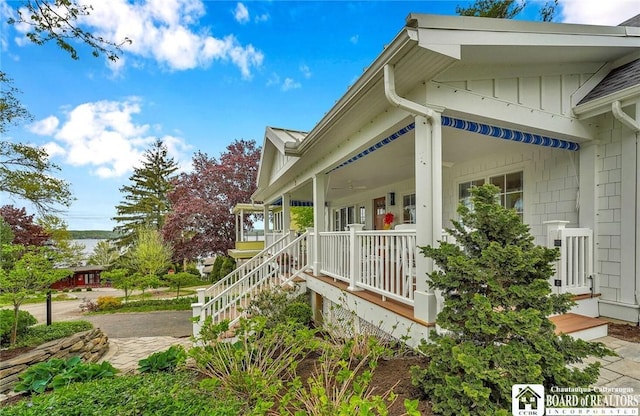 3 Maple Ave, Chautauqua, NY 14722 - view of side of property featuring covered porch and board and batten siding